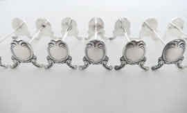 A set of 12 Silver Plated Louis XV Knife rests - France, 1900-1940
