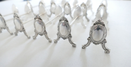 A set of 12 Silver Plated Louis XVI Knife rests - France, mid-20th century