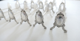 A set of 12 Silver Plated Louis XVI Knife rests - France, mid-20th century