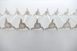 A set of 12 Silver Plated Rococo Knife rests - France, first half of the 20th century