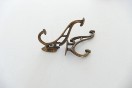 A pair of Art Nouveau coat hooks