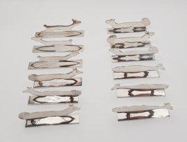 A set of 12 silver-plated, original Art Deco knife rests in the shape of animals
