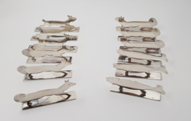 A set of 12 silver-plated, original Art Deco knife rests in the shape of animals