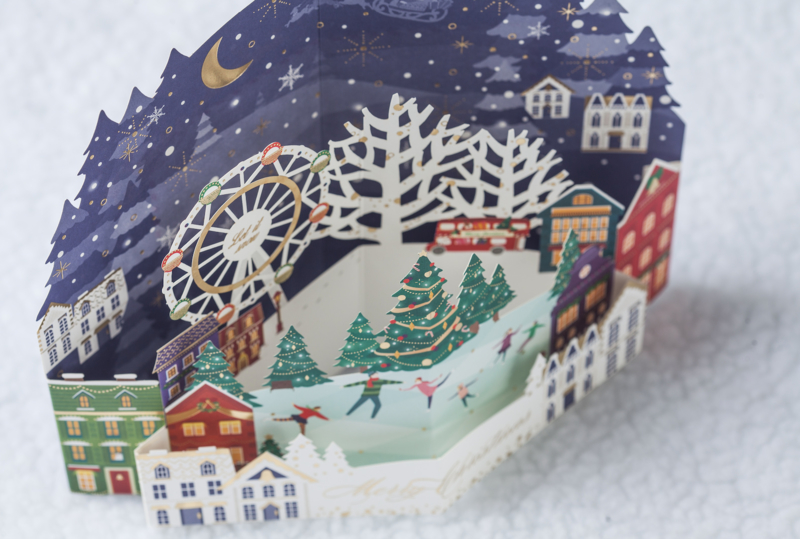 3D Pop up kerstkaart schaatsen bij de kerstboom en reuzenrad