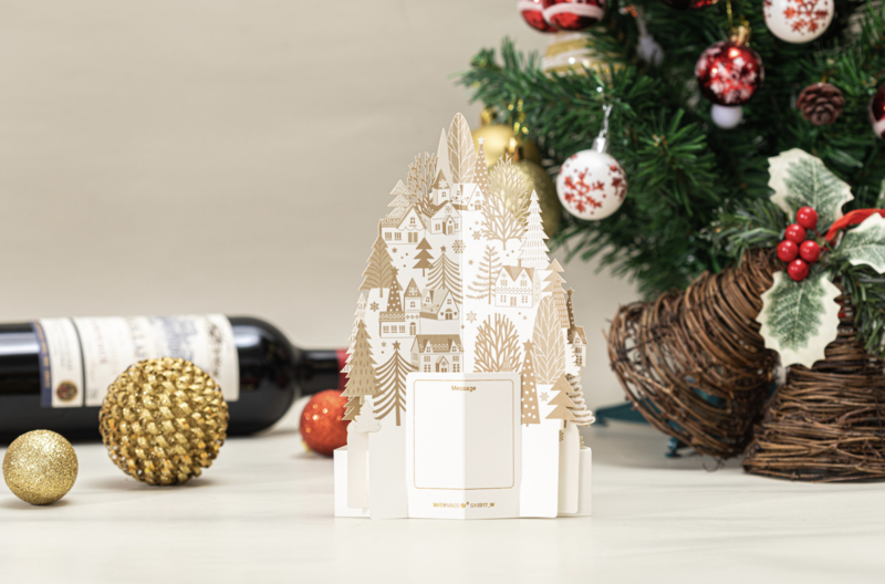 3D Pop up kerstkaart goud witte huizen op een sneeuwheuvel