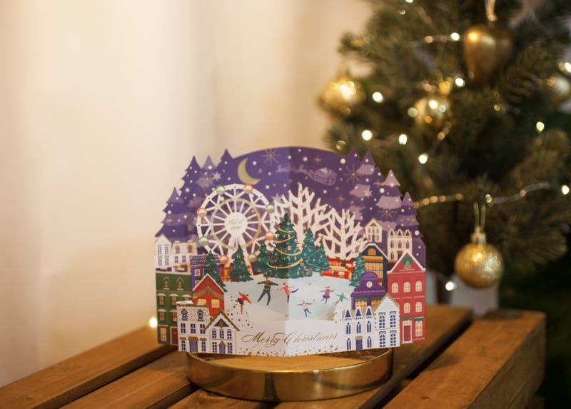 3D Pop-up Christmas card with ice skating by the Christmas tree and Ferris wheel