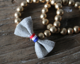Gouden houten kralen armbandje met strikje Linnen en rood-wit-blauw