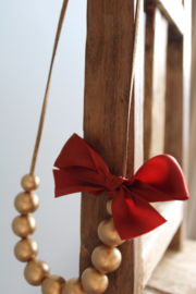 Gouden houten kralen ketting met strikje oranje