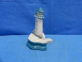 art nr: 840 vintage gietijzeren deurstopper van een vuurtoren
