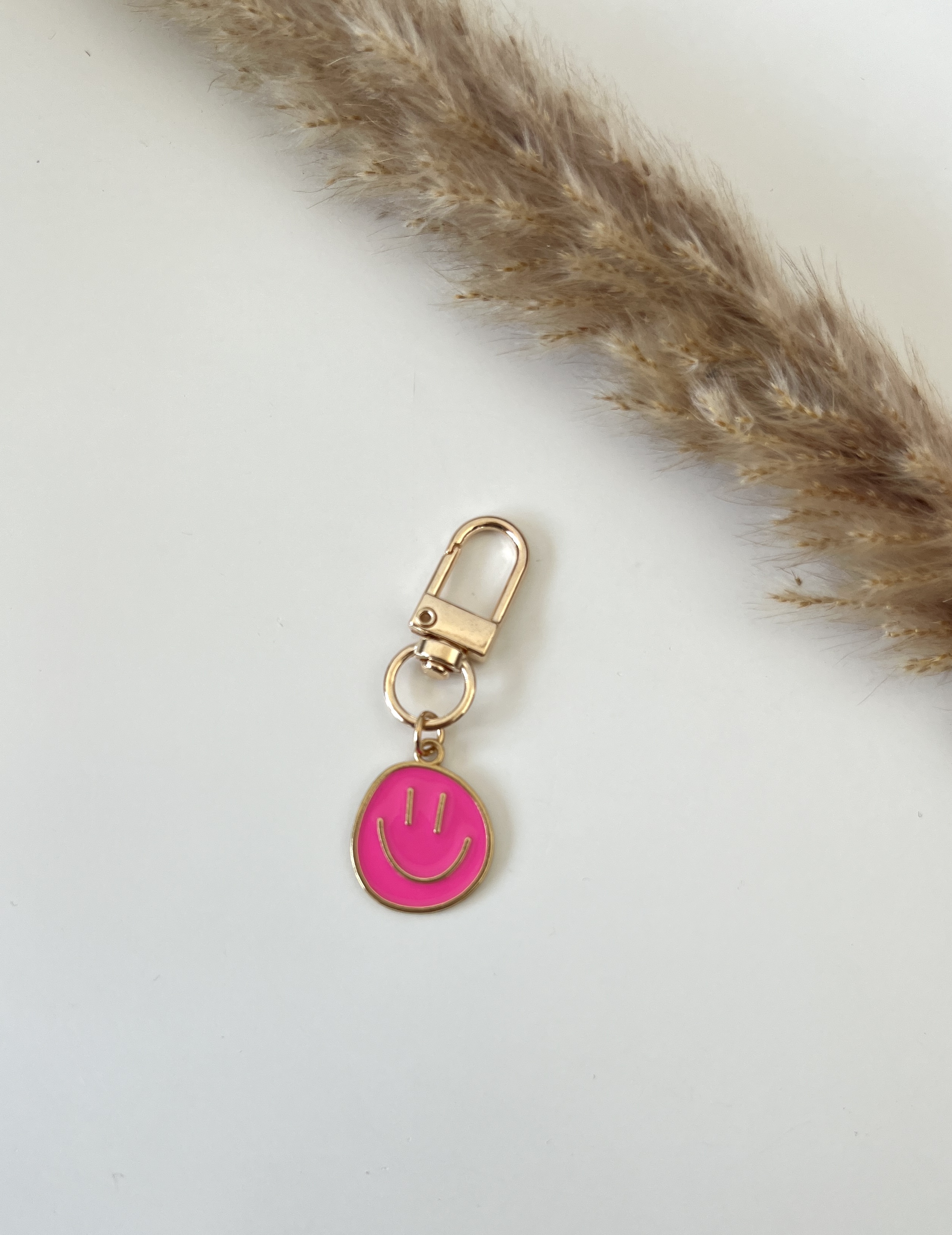 Sleutelhanger smiley roze