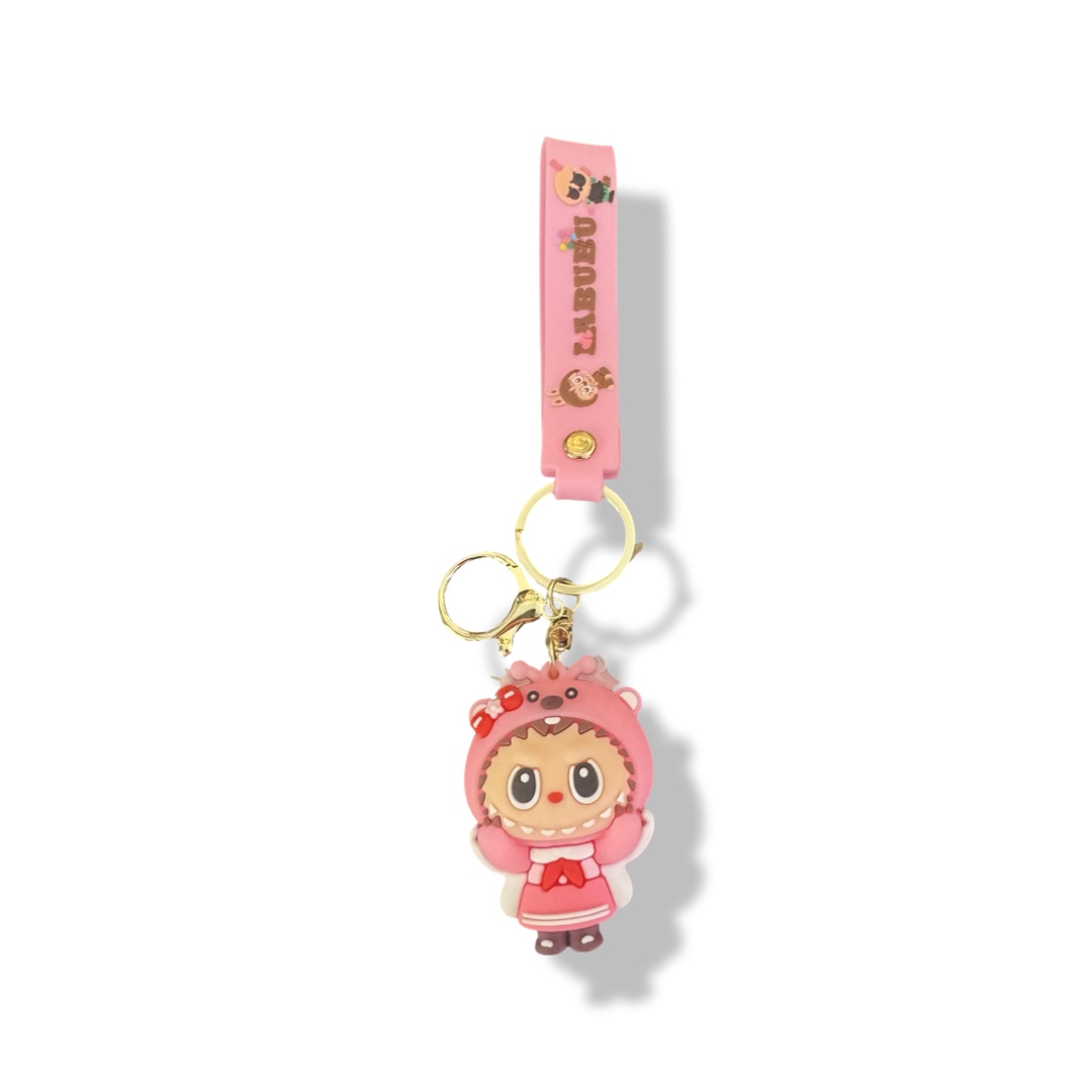 Labubu sleutelhanger met roze jurk en rood strikje