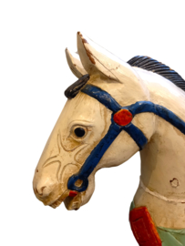 Antique hand-carved wooden horse sculpture.