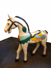 Antique hand-carved wooden horse sculpture.