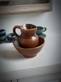 brown pitcher and bowl