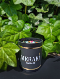 Candle with crystals and flowers