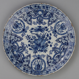 Plate with floral and ornamental decor