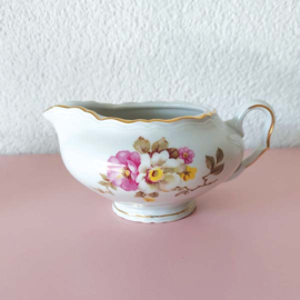 Brocante melkkan met bloemen roze, geel en wit