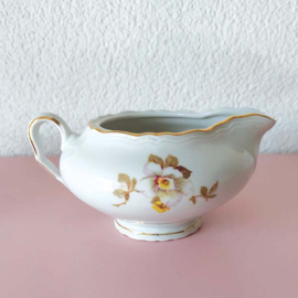 Brocante melkkan met bloemen roze, geel en wit