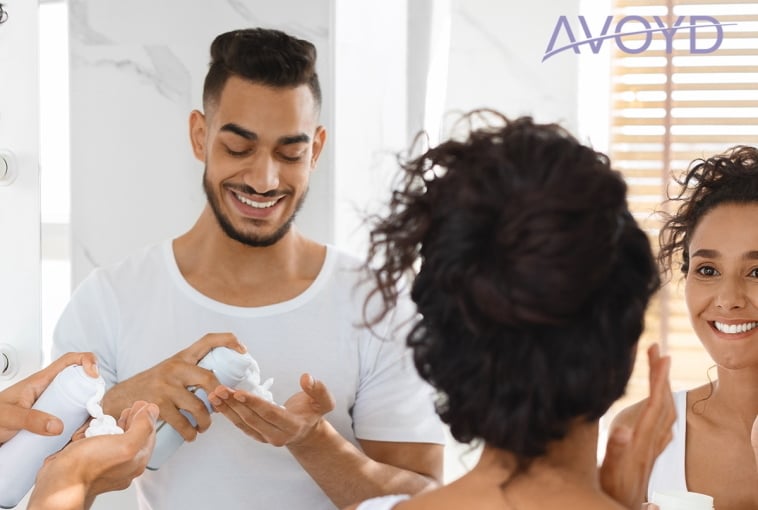 Couple in bathroom using AVOYD – discover the best product for your skin