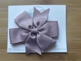 Grote strik oud roze