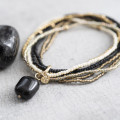 A beautiful story Nirmala black onyx gold armband