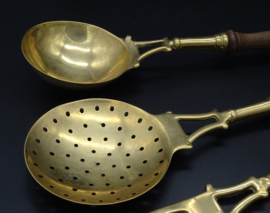 Set of brass kitchen utensils