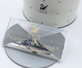 Titel plaquette Caring and Sharing (1987-1989)