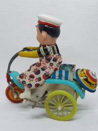 Blikken mannetje op de fiets