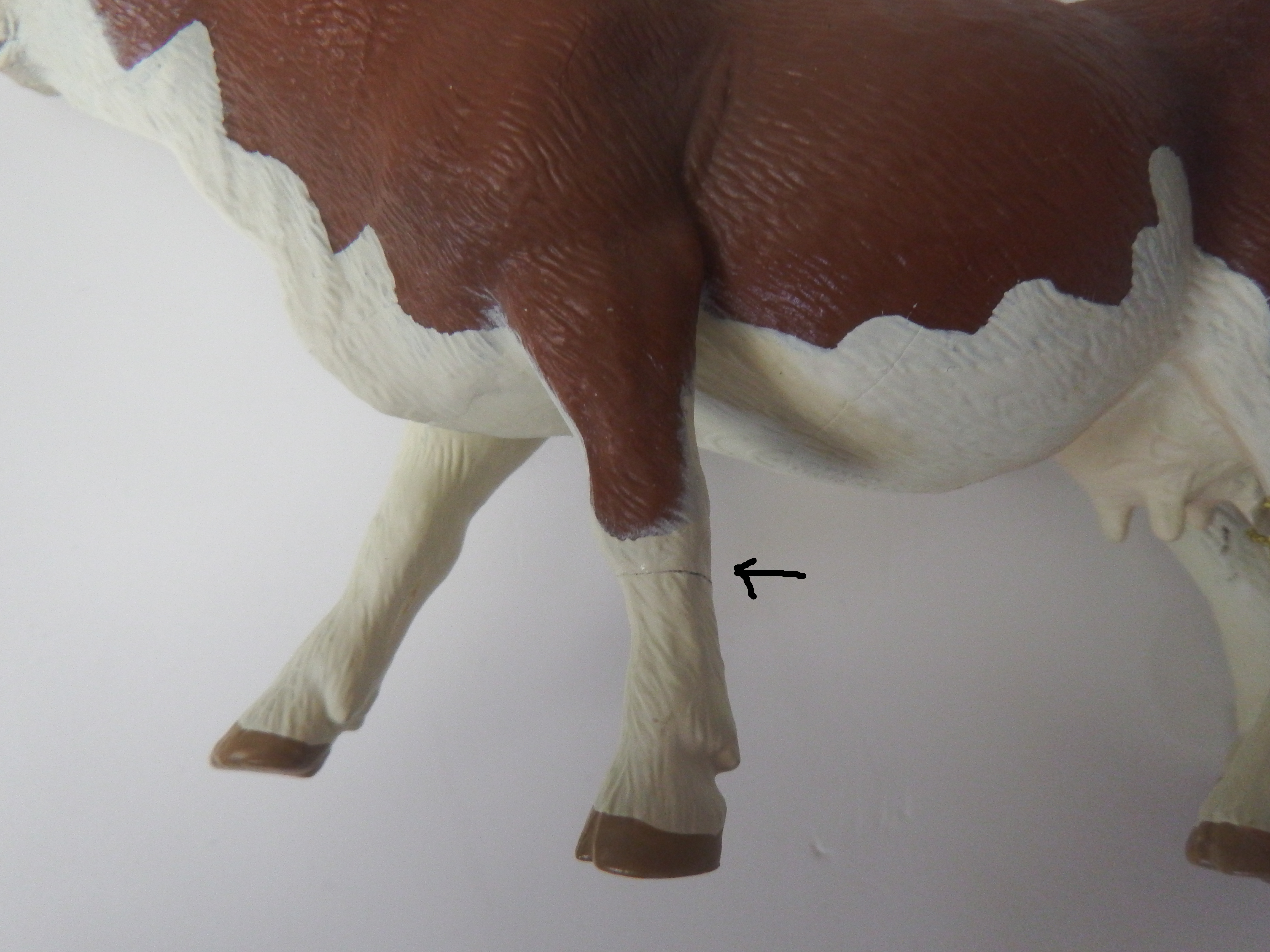 Simmental koe  Papo 51133  poot gelijmd