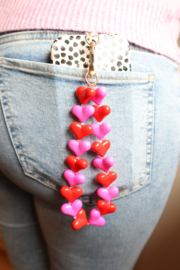 Roze en rode hartjes telefoon armband