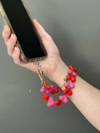 Roze en rode hartjes telefoon armband