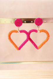 Hangers met roze en oranje kralen