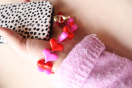 Roze en rode hartjes telefoon armband