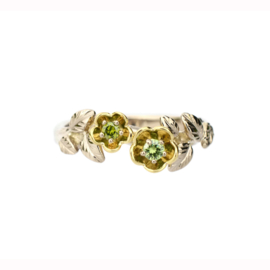 Golden ring with green diamond.